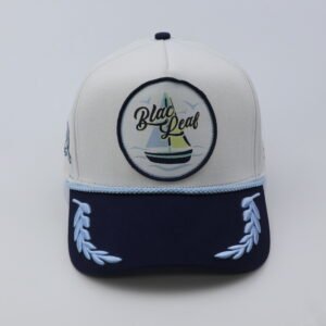 off white & navy two tone baseball cap with sailboat patch embroidery